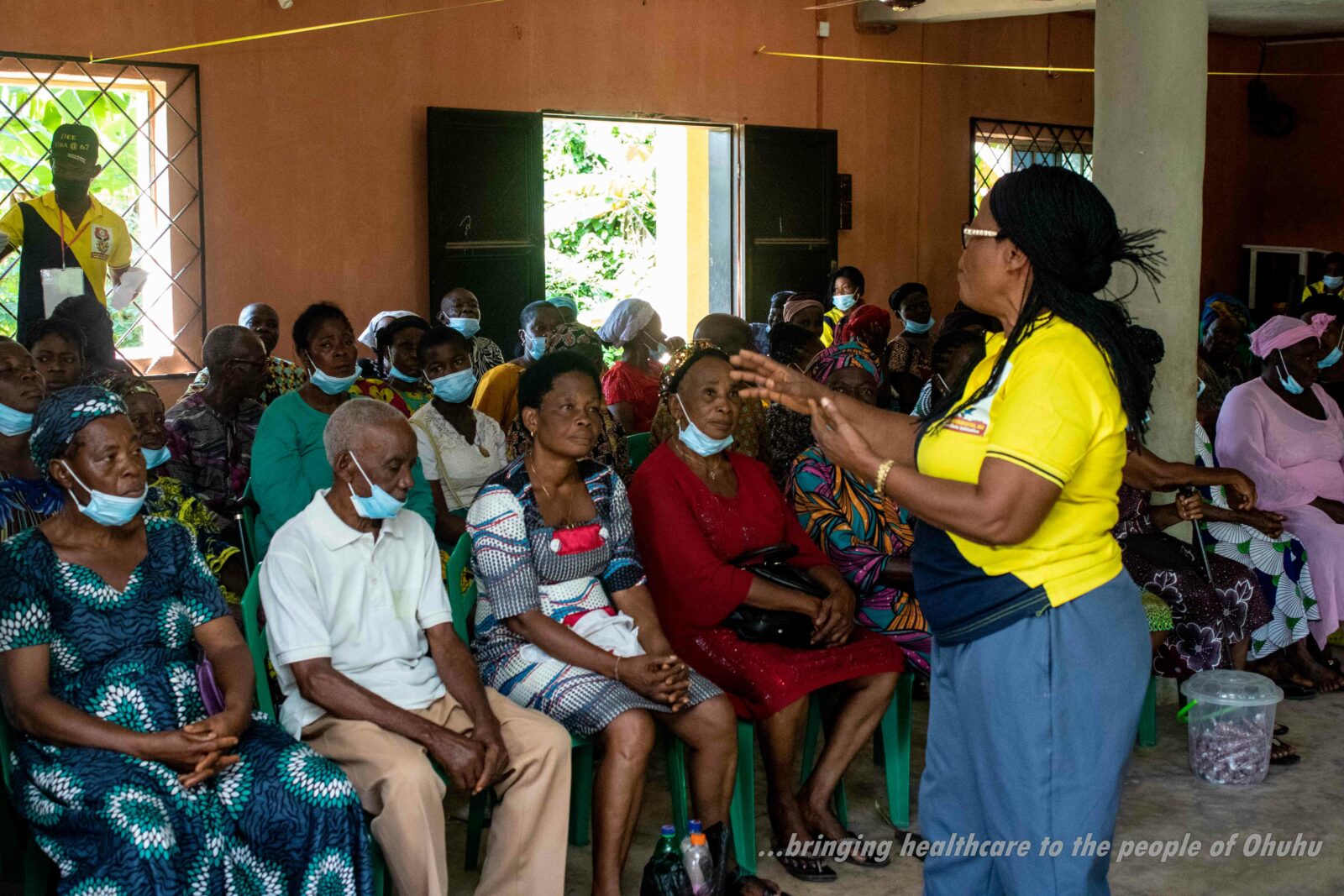 volunteer talking with community members